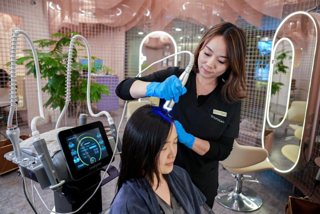 Follicle Boost Tri-Active scalp treatment being performed
